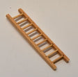 A miniature wooden ladder, likely for a dollhouse or model kit, shown diagonally on a plain off-white background.