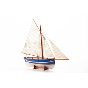 A wooden model sailboat with cream-colored sails, a blue and white hull, and a brown wooden frame, displayed on a small wooden stand against a plain white background.