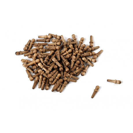 A pile of small brown wooden pegs or dowel-like hardware pieces on a plain white background, with two pieces placed separately to the right.