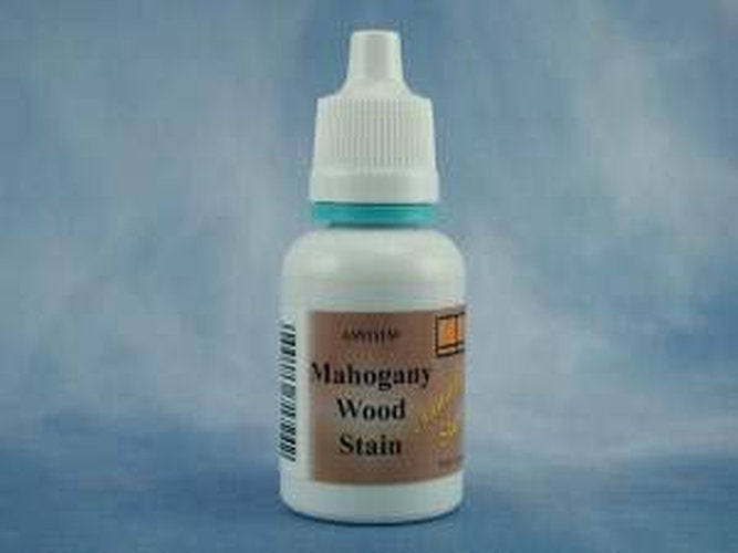 A small white plastic bottle of Mahogany Wood Stain with a white cap, featuring a brown label, set against a mottled blue background.